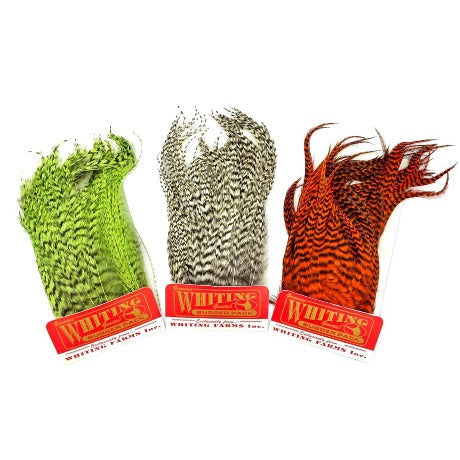 Three packs of Whiting Farms Bugger Pack feathers for fly tying, displayed with their respective green, gray, and red color feathers visible.